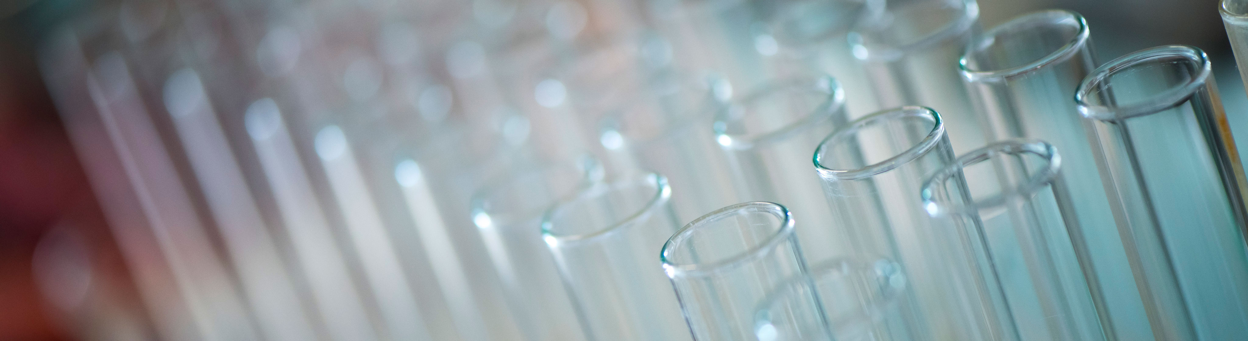 Dozens of test tubes in a holder